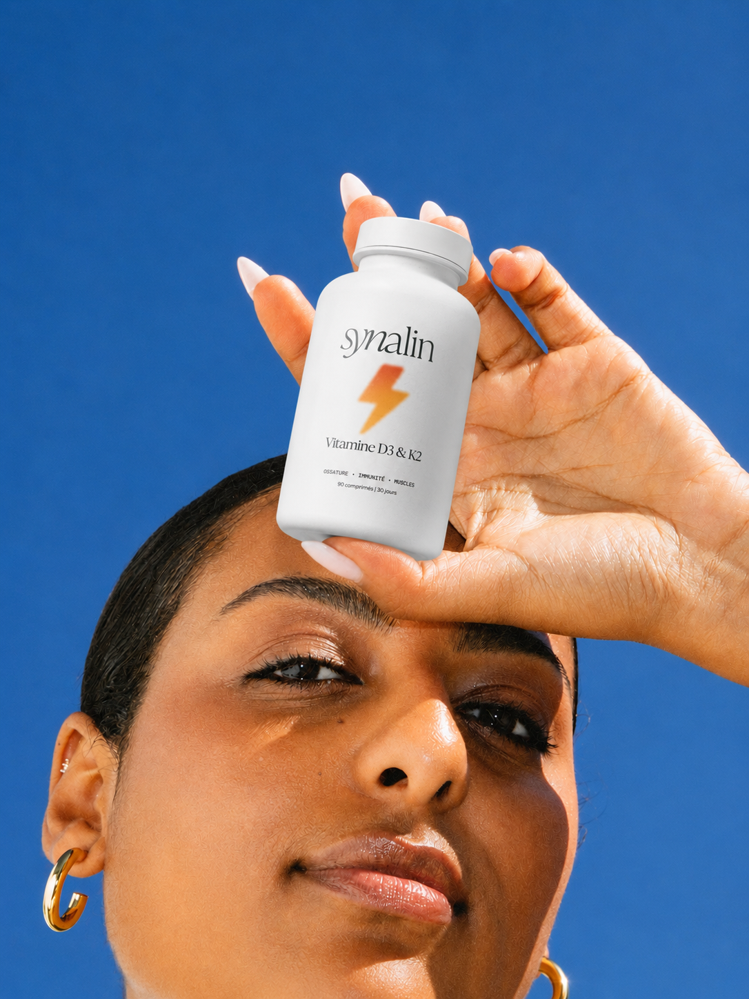 Femme profitant du soleil pour favoriser la synthèse naturelle de vitamine D